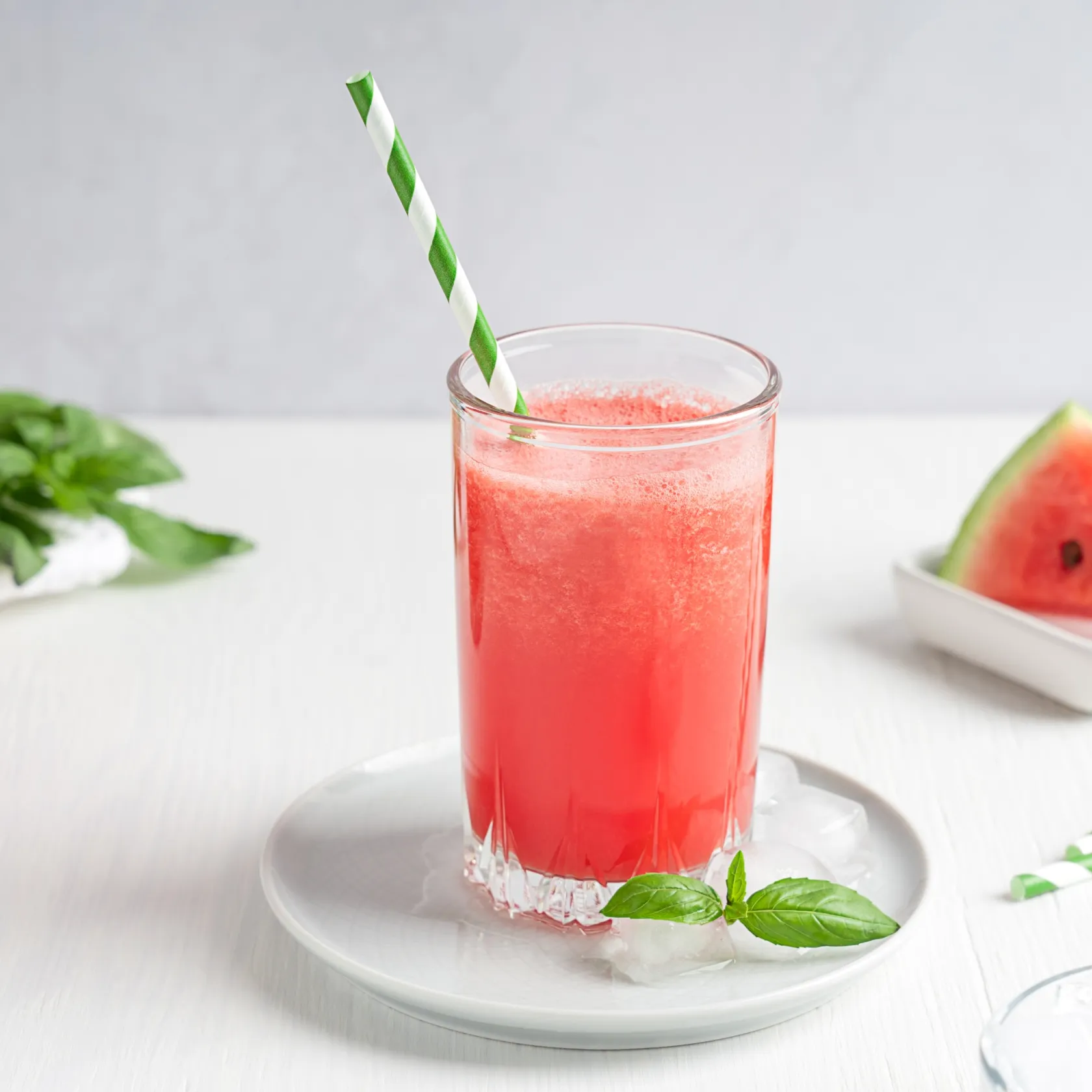 Pulpy and bright red zero-proof drink that looks fresh and filled with watermelon.